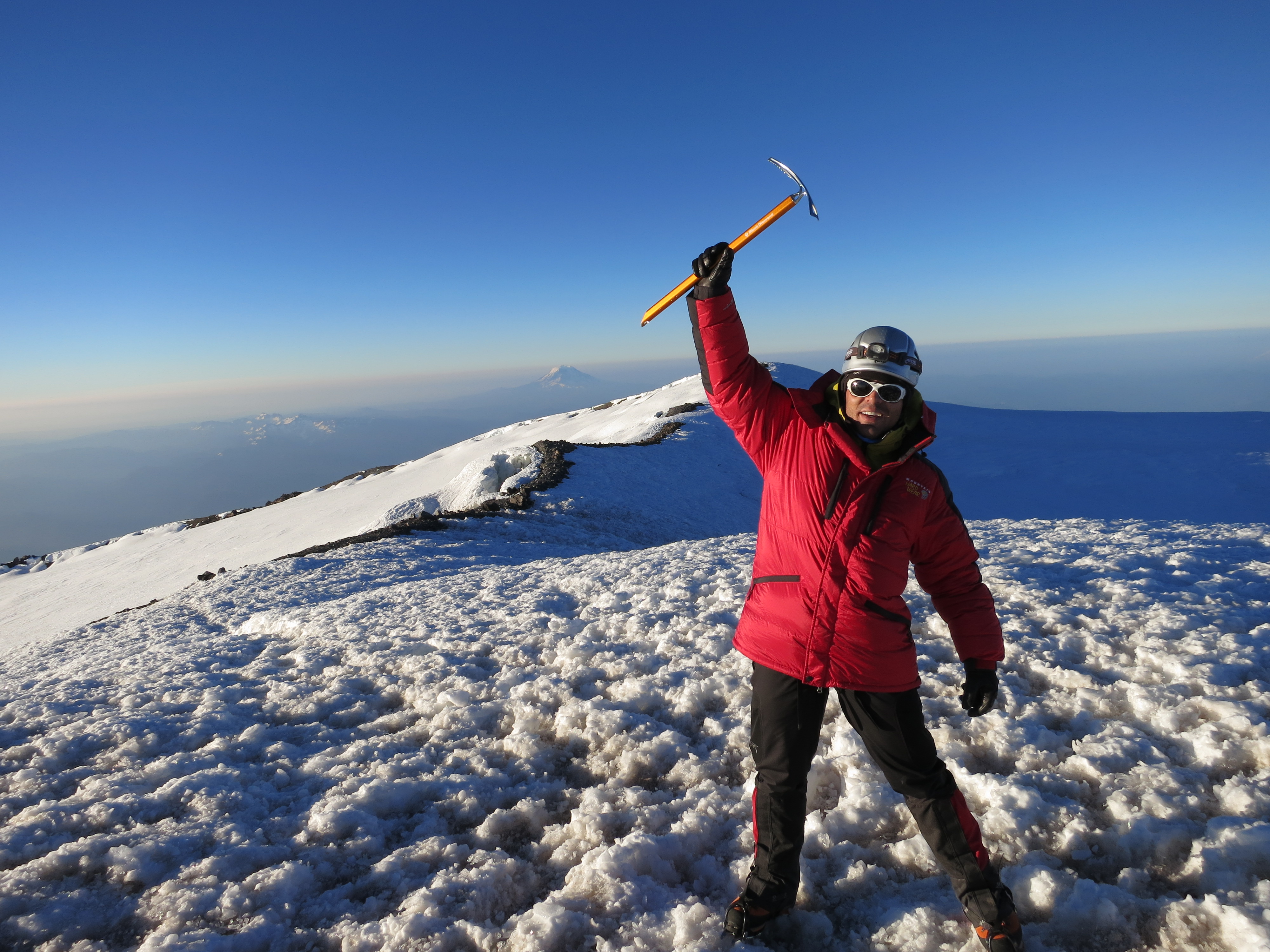 Laszlo at the summit of Mt. Rainier with ice axe